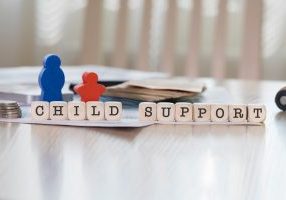 Word,Child,Support,Composed,Of,Wooden,Letters.,Closeup