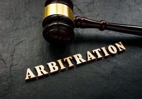 Arbitration,Word,From,Wooden,Letters,And,Gavel,In,Court.
