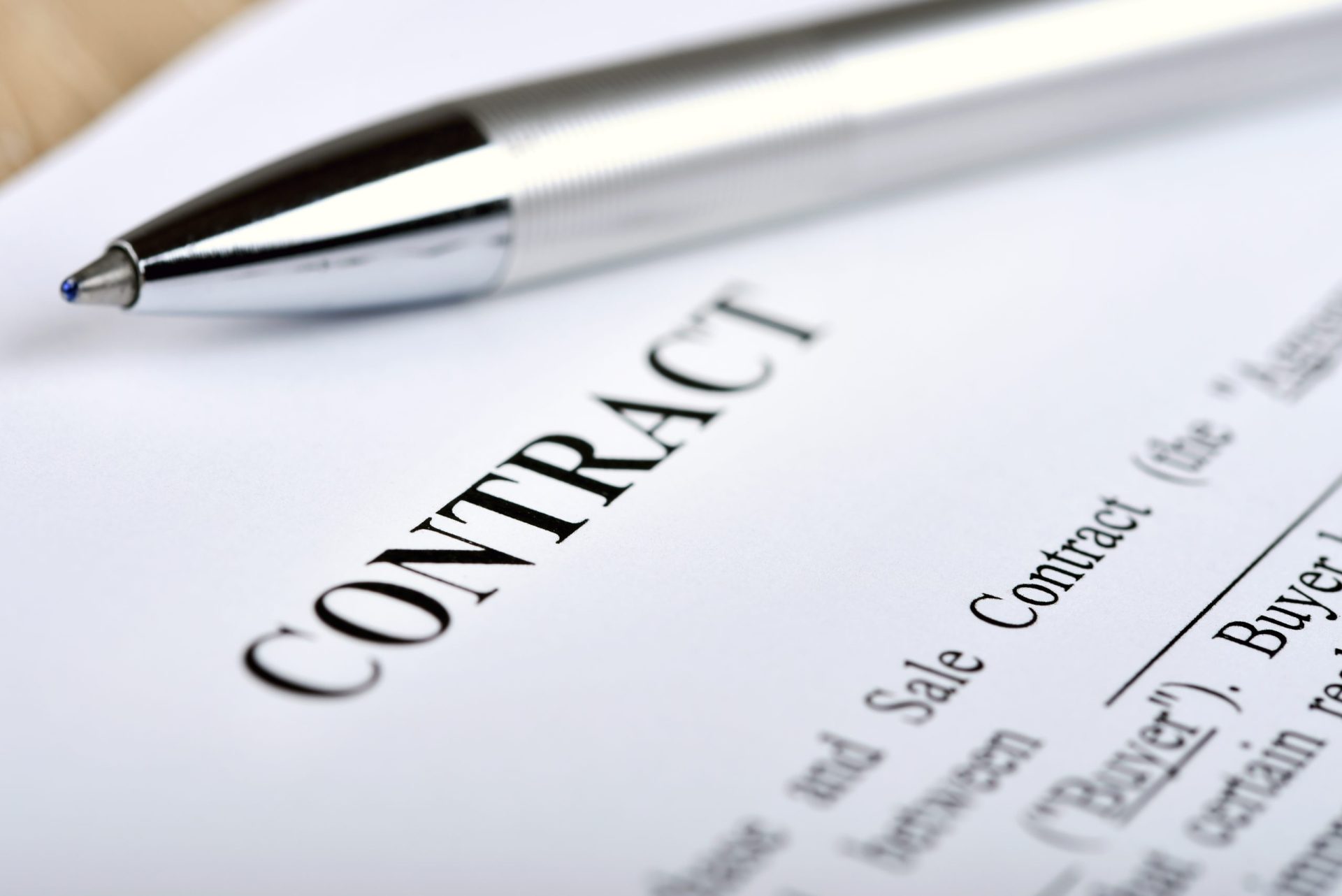 closeup of a contract with a silver pen